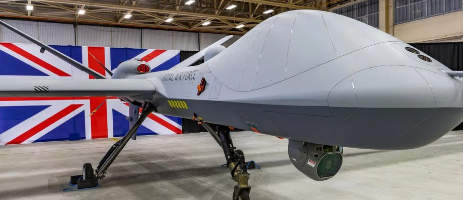 Royal Air Force drone displayed in hangar with Union Jack backdrop