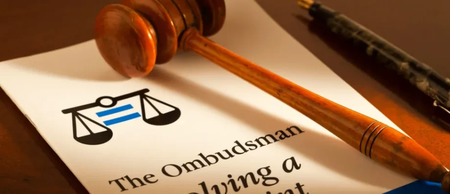 Gavel on ombudsman complaint resolution document, symbolising justice and conflict resolution in the UK
