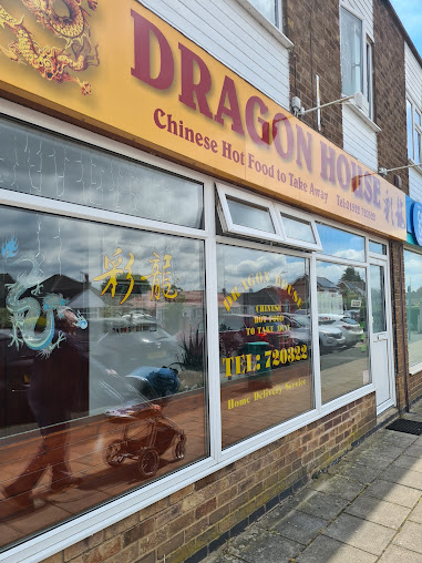 Exterior of Dragon House, a Chinese takeaway with vibrant signage in England, offering home delivery service