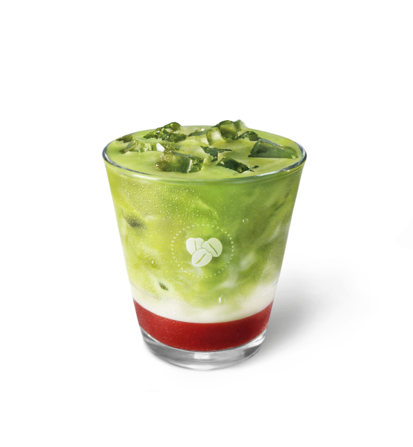 Iced matcha latte with red and white layers in a clear glass, garnished with ice cubes for a refreshing look