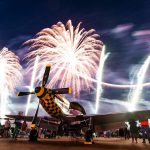 Spectacular night air show featuring vintage aircraft and vibrant fireworks display