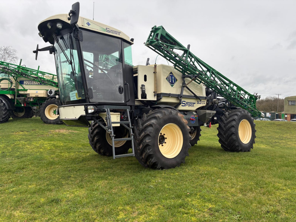 Large agricultural machine, Spirit S3-24 sprayer, parked on grass, highlighting advanced farming technology