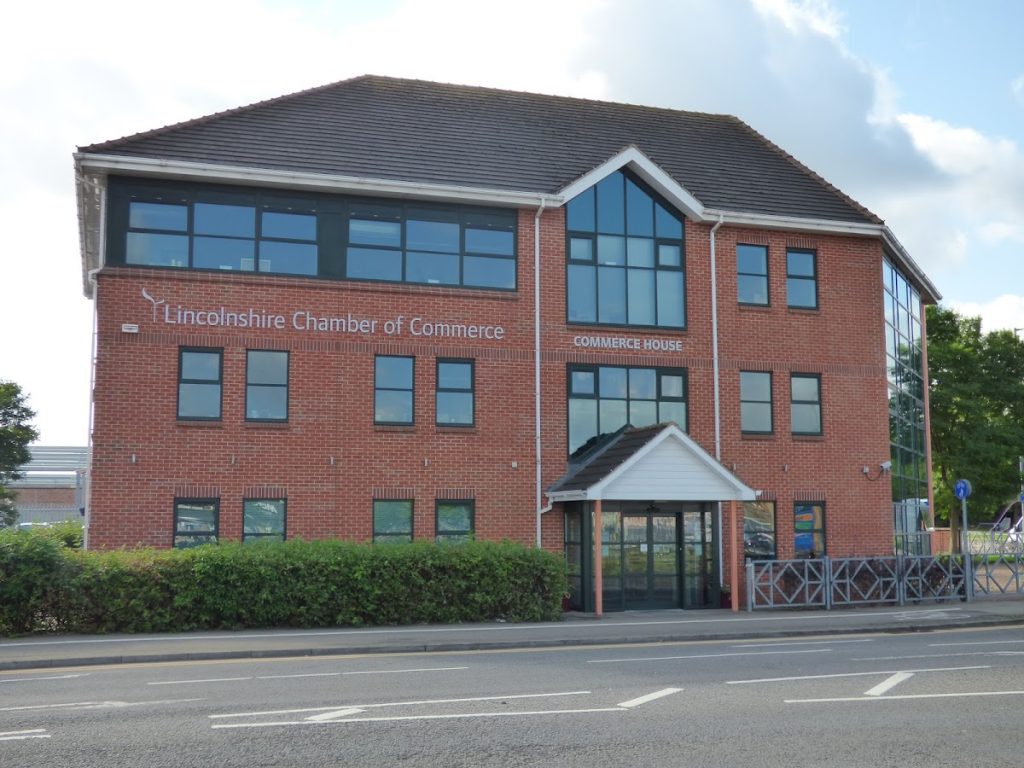 Front view of Lincolnshire Chamber of Commerce building with clear blue sky in the background