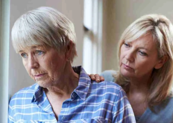 Women sharing a comforting moment by the window, depicting emotional support and understanding