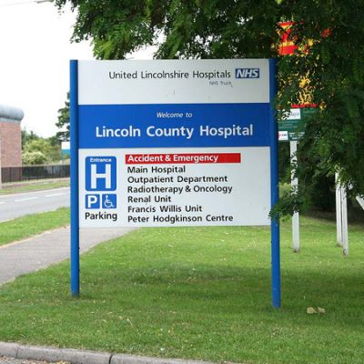Welcome sign for Lincoln County Hospital displaying departments and facilities like Accident & Emergency and Radiotherapy